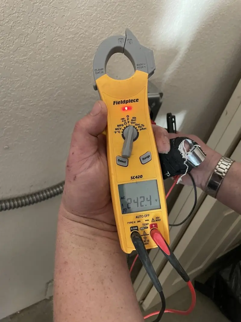 Voltage testing with clamp meter during Electrical Installation Services in Sheboygan